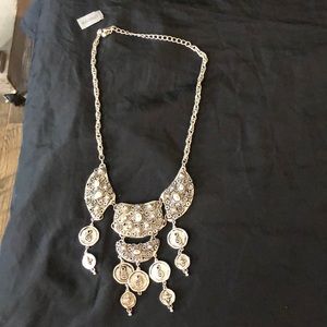 This necklace is Silver new with tags